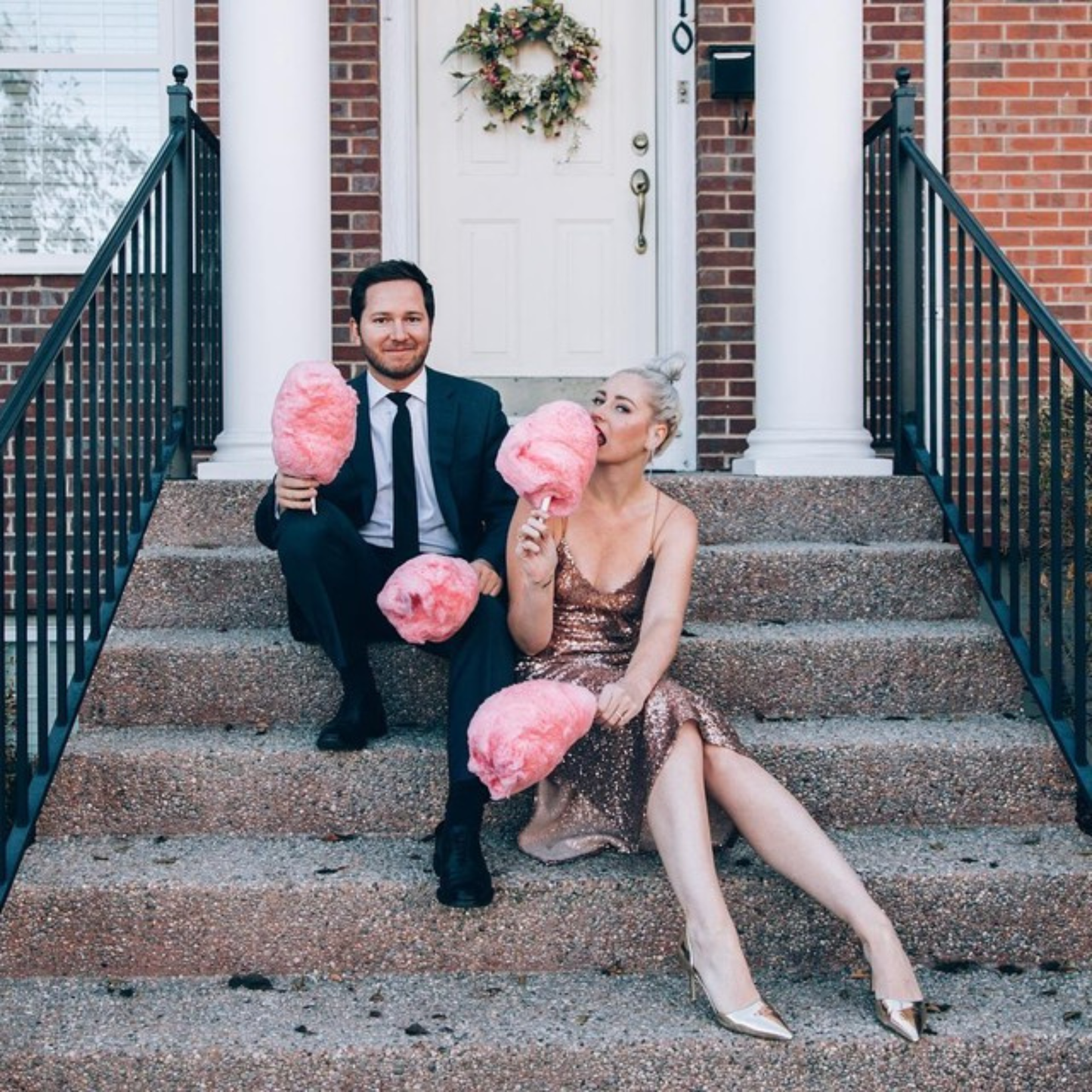 a couple eating Custom gourmet cotton candy on their second anniversary by Calgary candy vendor The Sugar Cube.