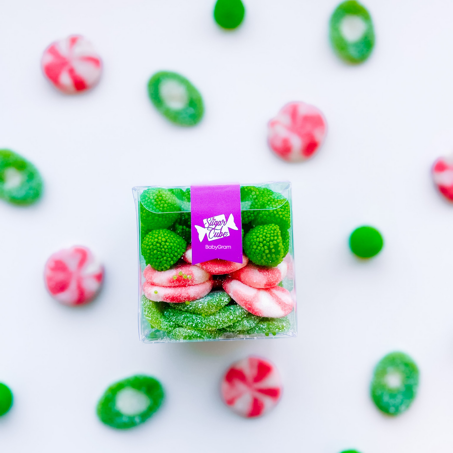 Baby holiday CandyGram filled with a cheerful pink and green Merry and Bright Christmas candy mix