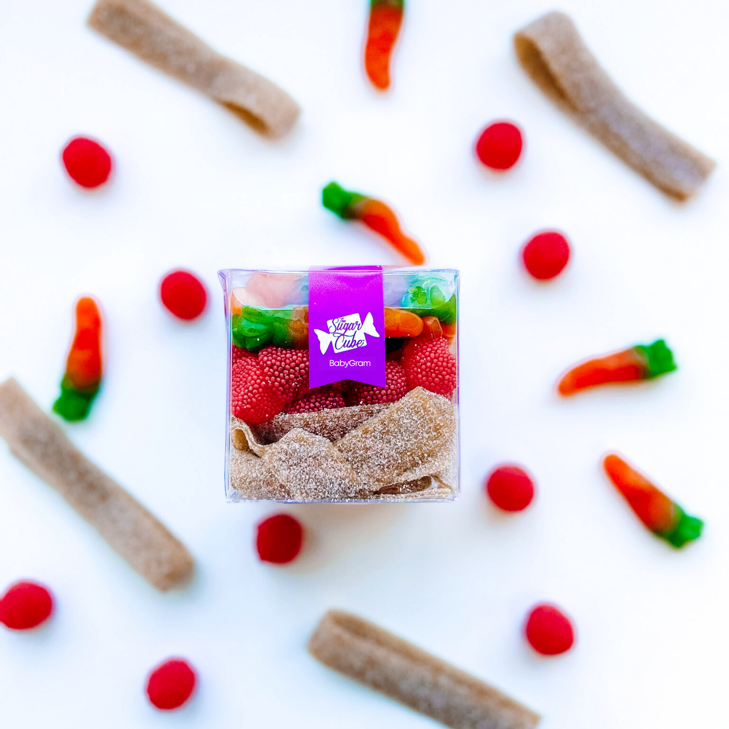 Baby Christmas CandyGram filled with the red and brown Rudolph's Stash candy mix with gummy carrots and gumdrops
