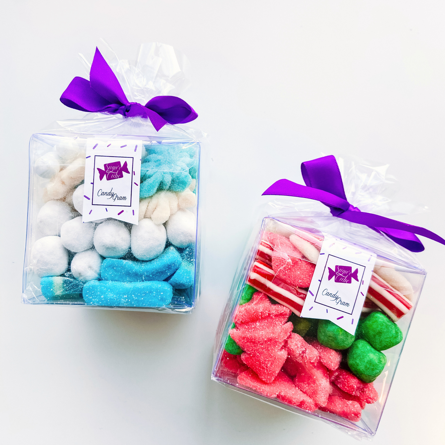 Two holiday CandyGrams featuring playful holiday mixes with wintry white and blue or festive red, green and white candy