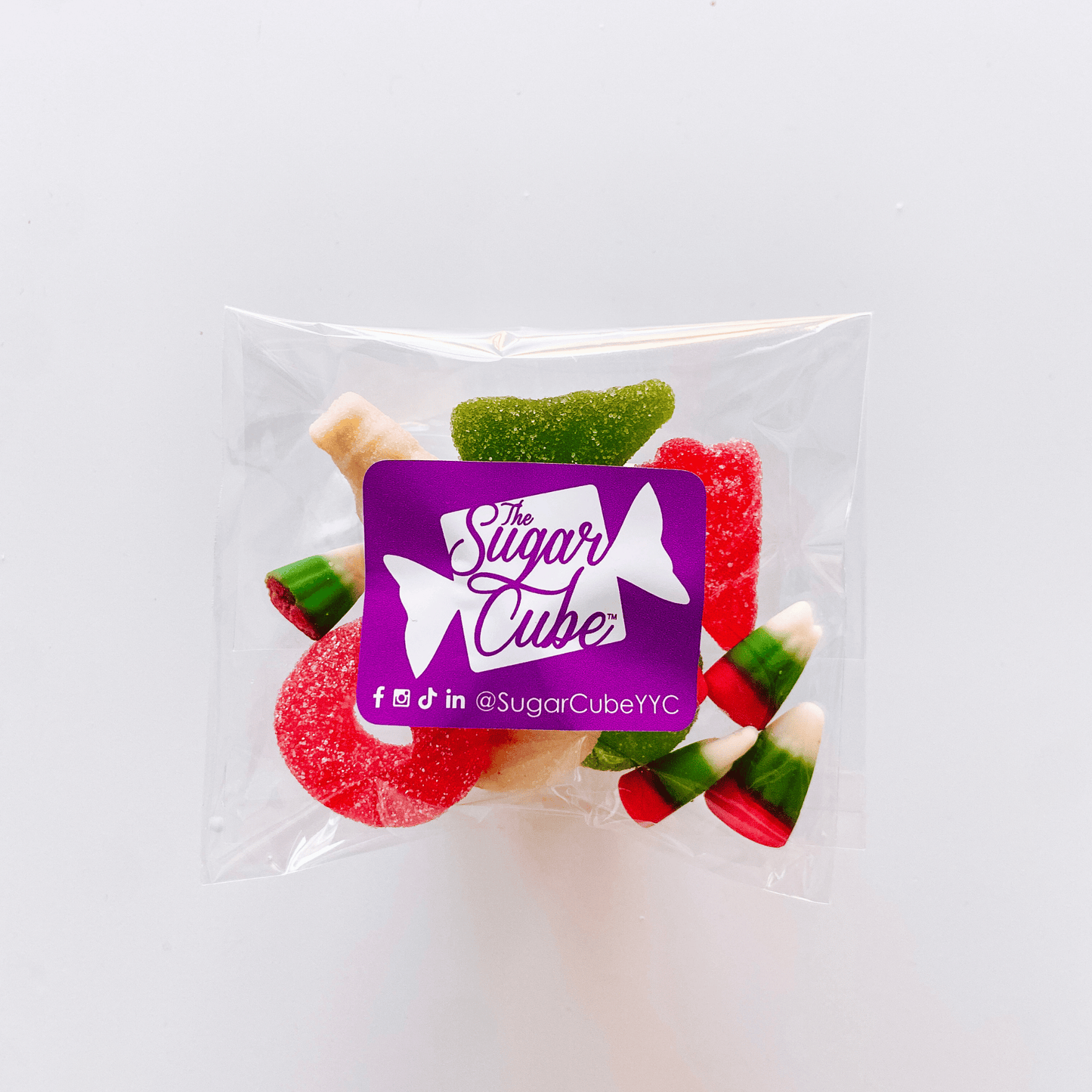 Festive holiday candy bag filled with approximately 50g of colourful red, green and white assorted candy