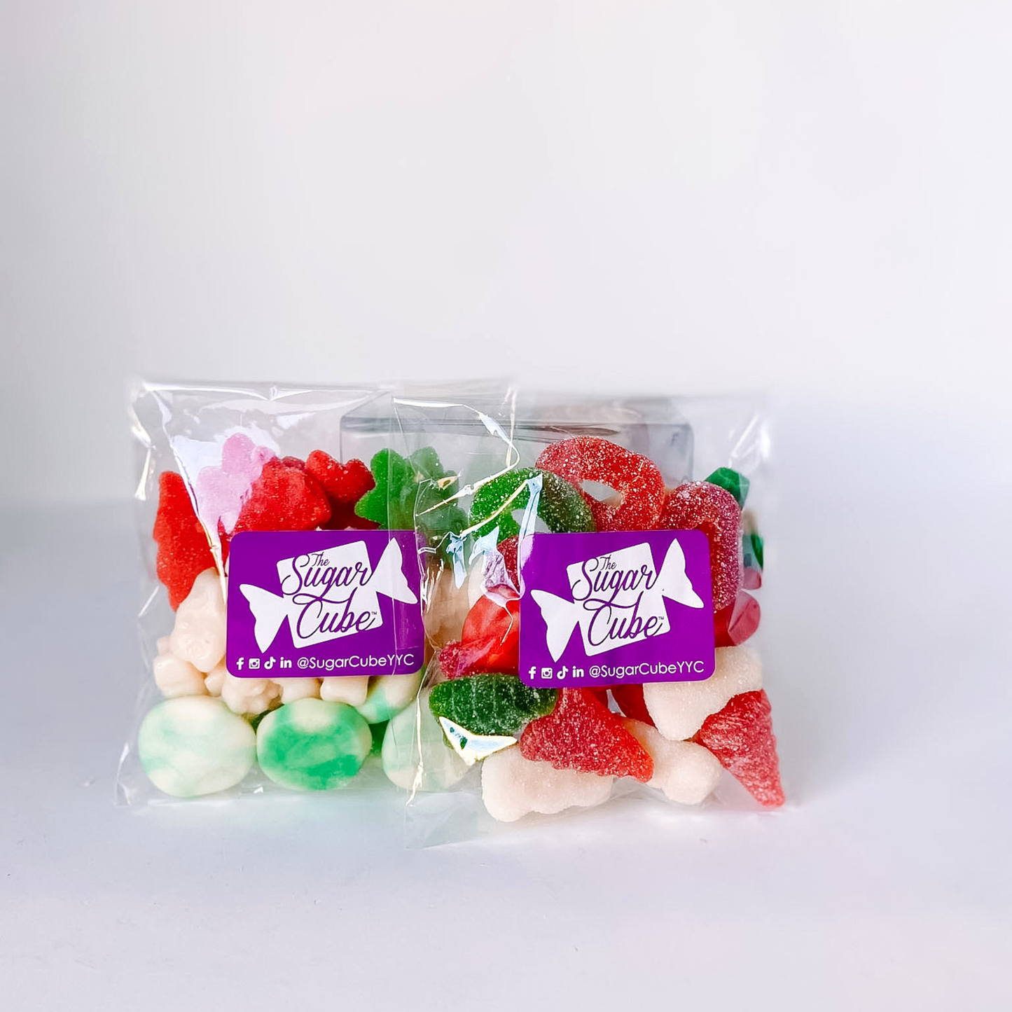 Two Home Alone Christmas candy bags featuring a bright colourful mix inspired by the holiday season