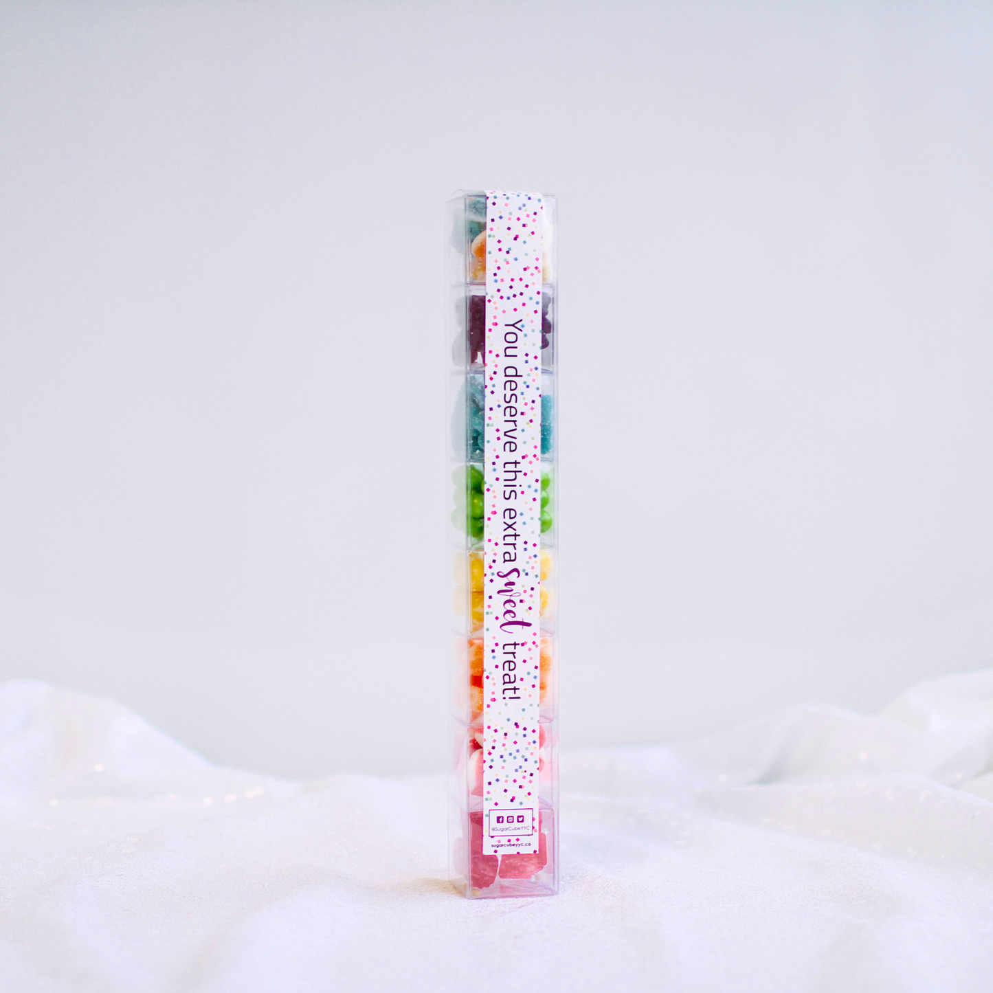 Large Christmas candy Sweet Stack filled with eight assorted seasonal sweets in a tall gift-ready package