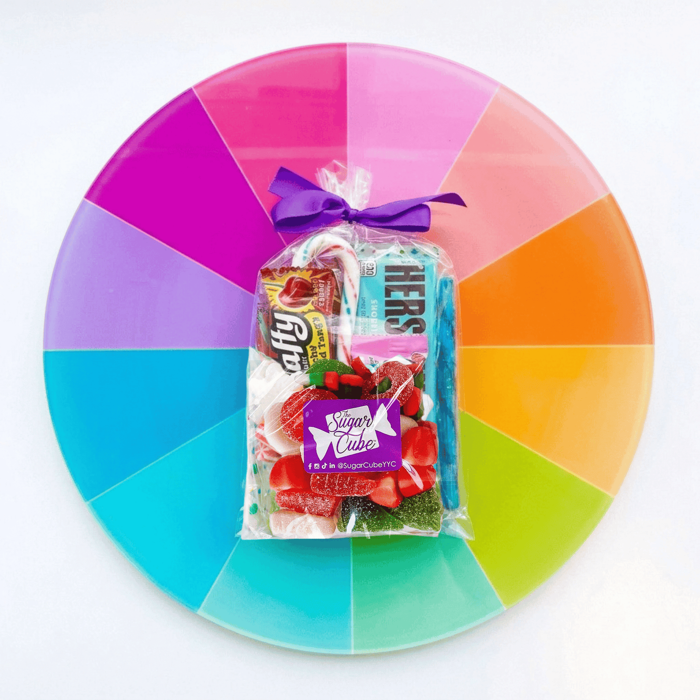 Retro Christmas stocking stuffer gift bag filled with nostalgic wrapped candy, candy canes and festive gummies