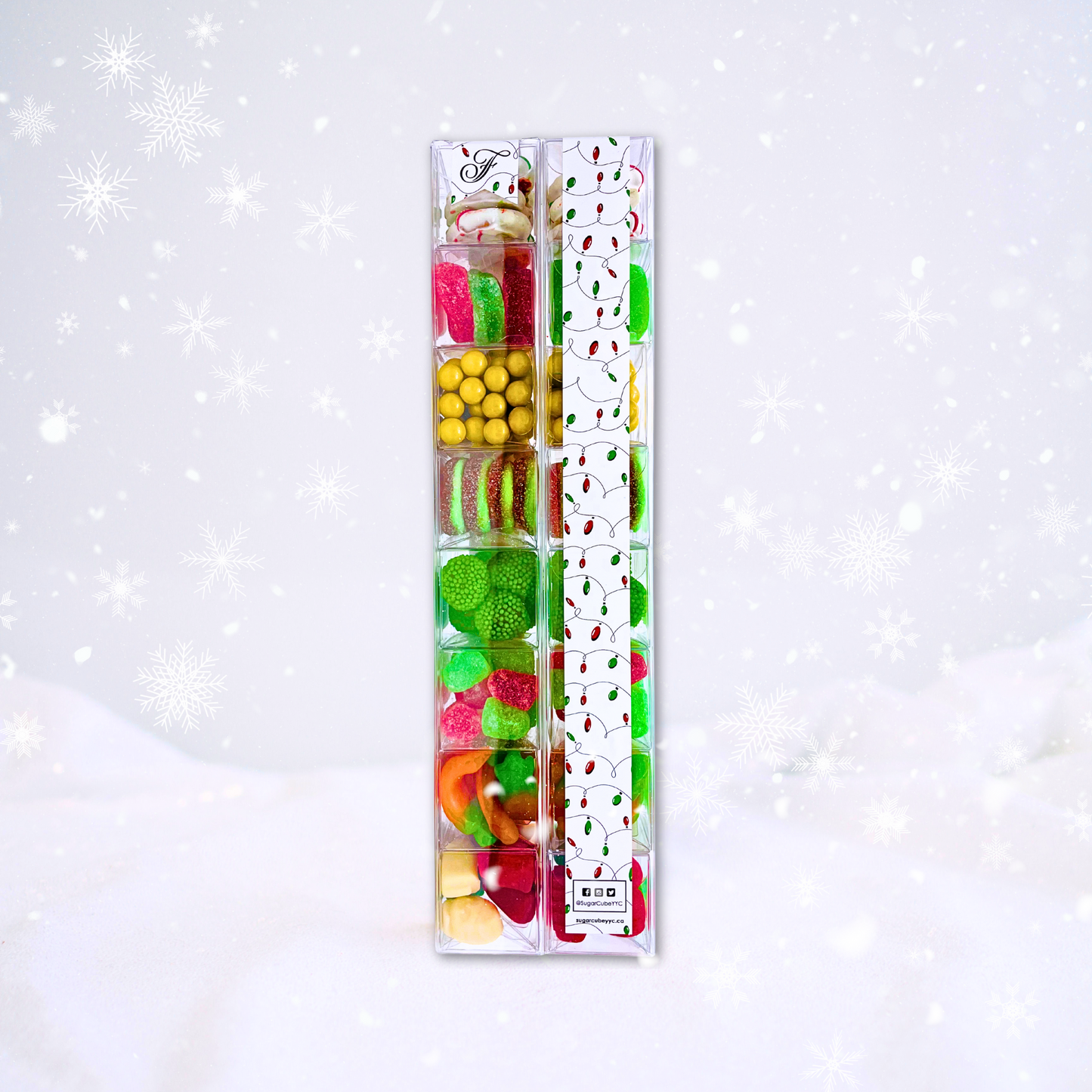 Front and back views of a Large Christmas Sweet Stack showing eight festive candy layers and a custom corporate sticker for Fairmont Hotels & Resorts