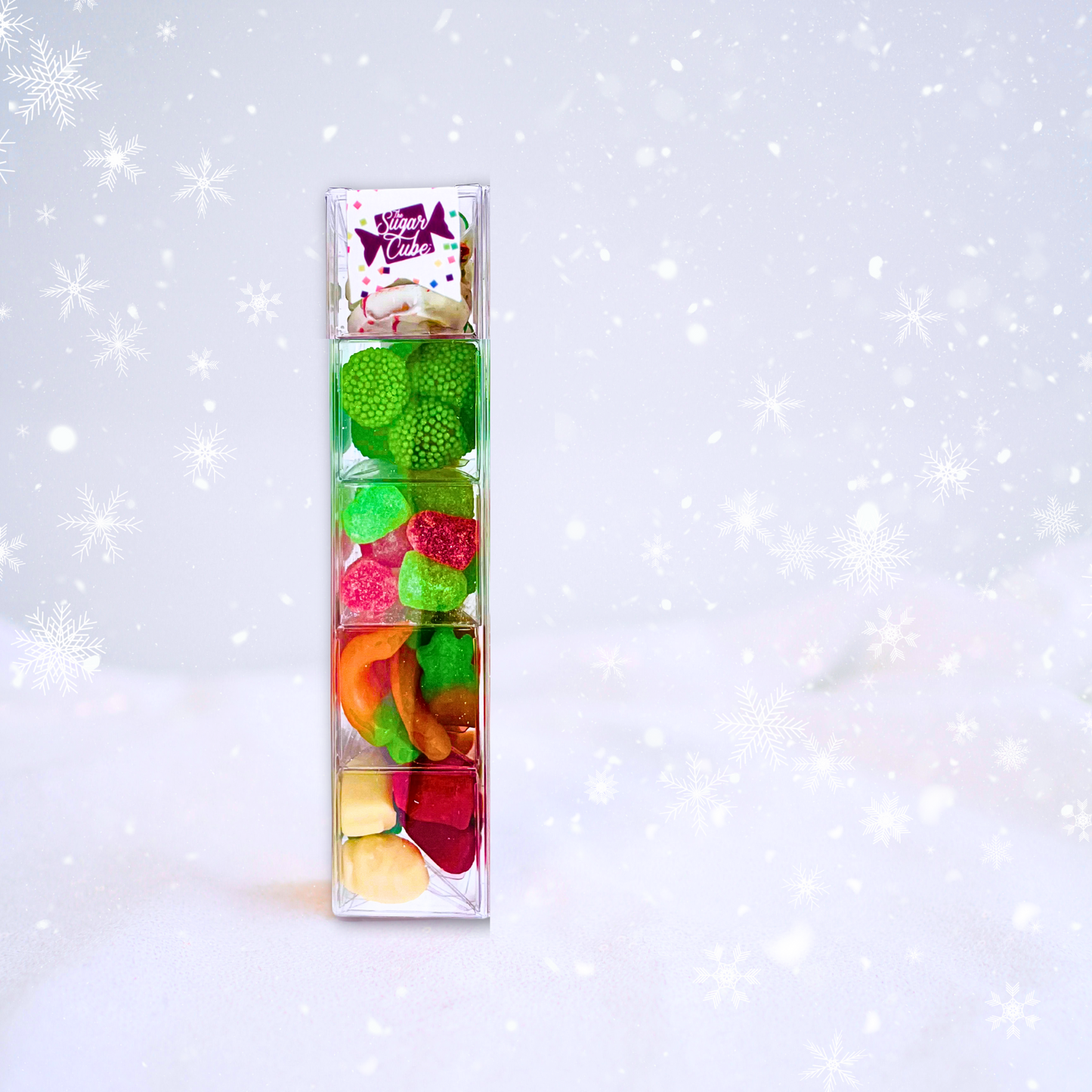 Christmas candy Sweet Stack filled with five assorted seasonal sweets in a tall gift-ready package