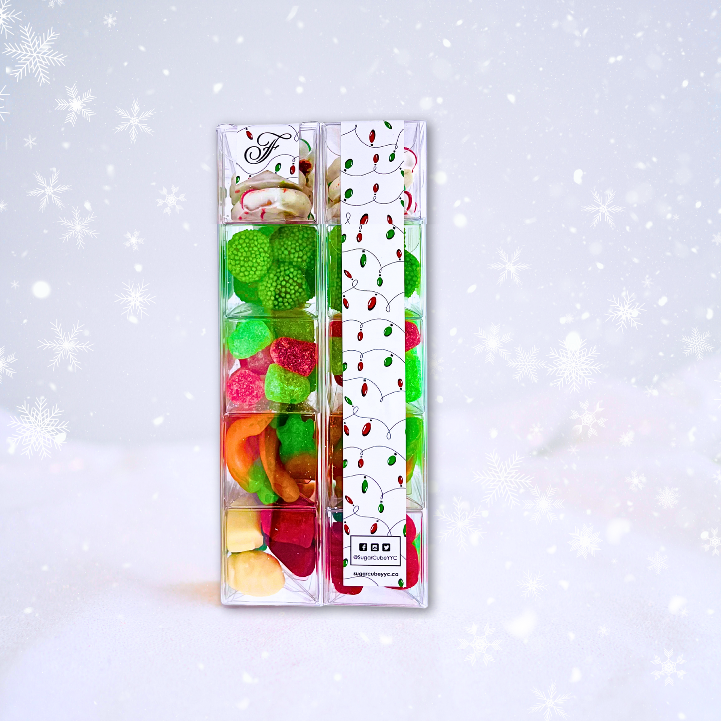 Front and back views of a Small Christmas Sweet Stack showing the festive candy layers and custom corporate sticker