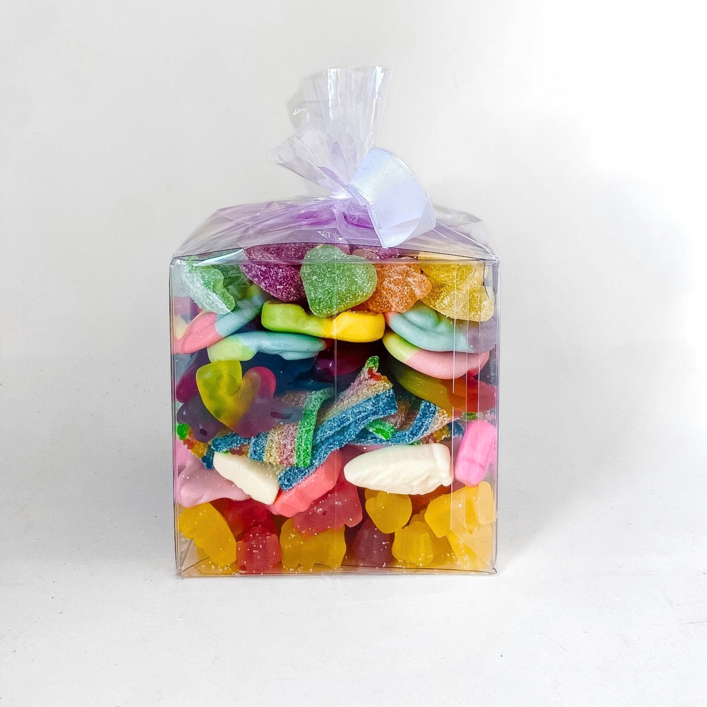 Colourful assortment of vegan gummies and candy inside The Sugar Cube Vegan CandyGram.