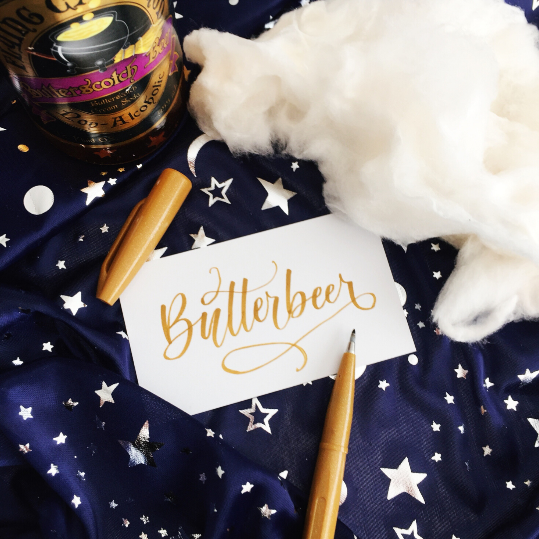 Butterbeer cotton candy with Butterbeer written in magical lettering