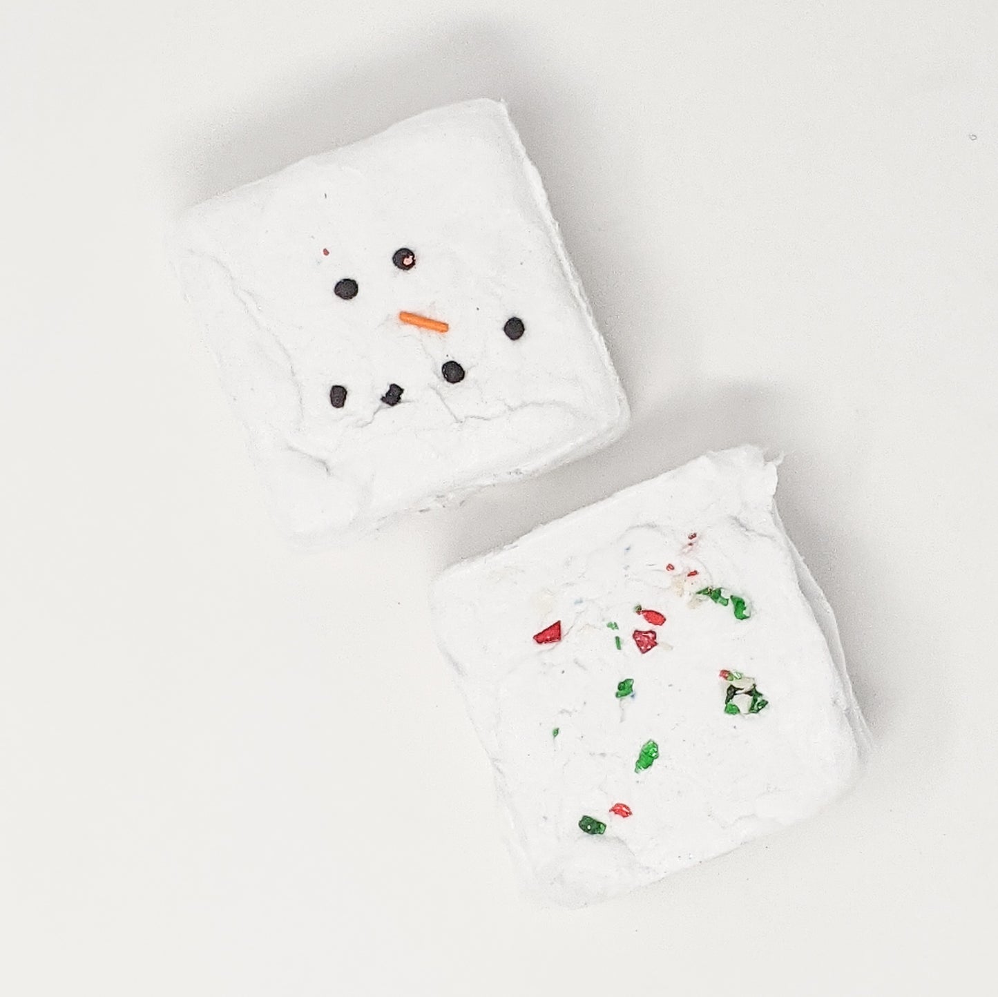 Marshmallow Snowman and Candy Cane Delight hot chocolate cotton candy bombs in festive marshmallow and peppermint flavours
